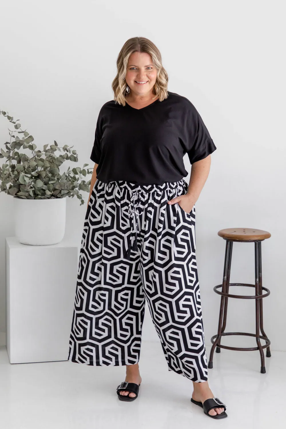 Chic Simplicity: Black Blouse and Black & White Geo Wide Leg Pants