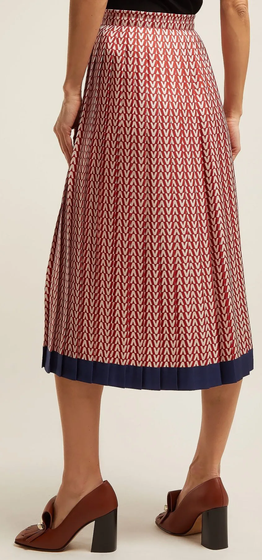 Logo Intarsia Sweater and Optical Print Pleated Midi Skirt